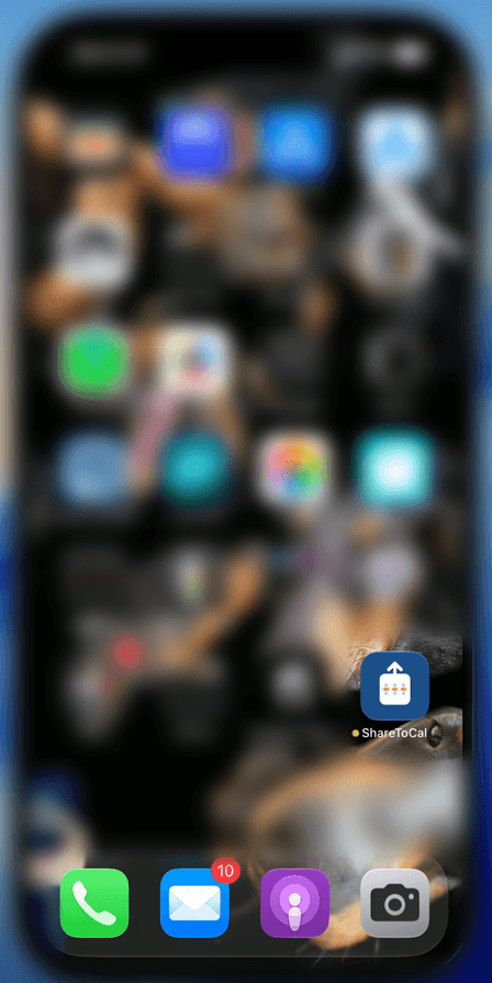 ShareToCal's icon on the home screen, other apps and background blurred for privacy